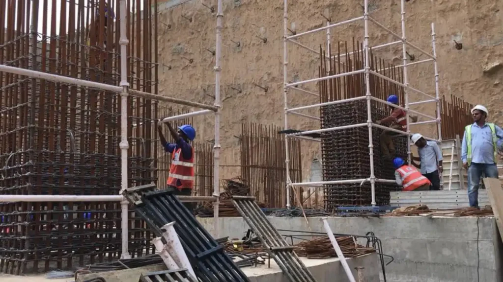 Two construction workers working on a diaphragm wall construction site