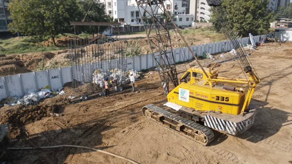 A cage wall for the diaphragm wall being lowered into an excavated area of a construction site